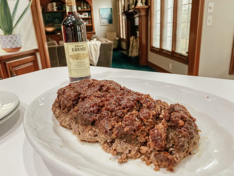 Meatloag topped with brown sugar and chili sauce. 